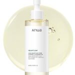 Anua Heartleaf Pore Control Cleansing Oil 200ml pump bottle on white background with oil texture