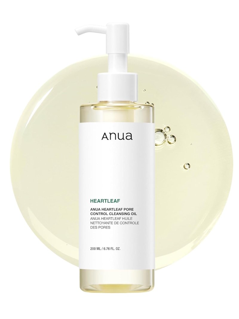 Anua Heartleaf Pore Control Cleansing Oil 200ml pump bottle on white background with oil texture