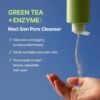 Pouring the fine green tea powder cleanser into hand