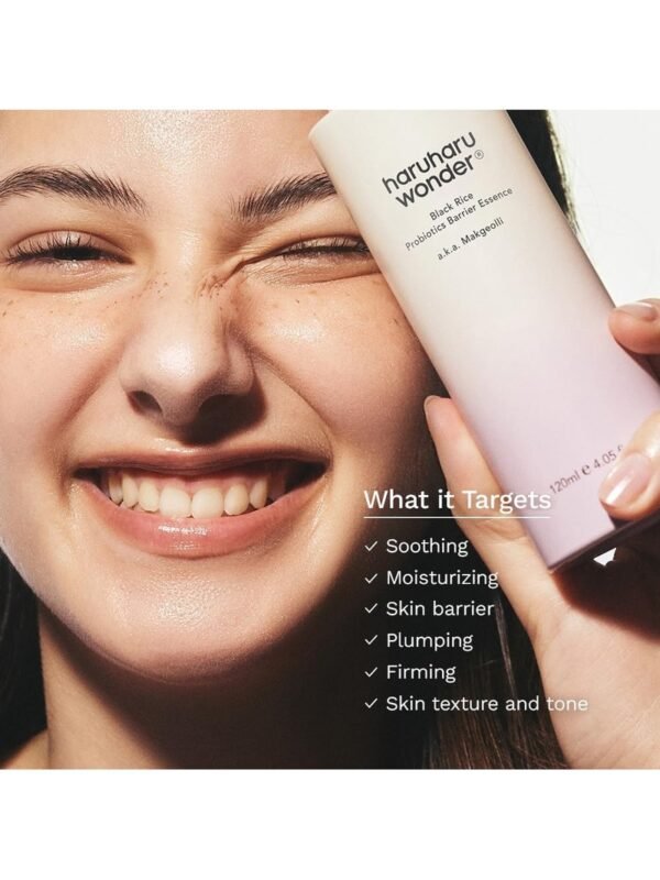 Haruharu Wonder Barrier Essence – Lifestyle Shot Glowing Skin Smiling model with glowing healthy skin holding Haruharu Wonder Black Rice Probiotics Barrier Essence – targets soothing, moisturising, plumping, firming and skin texture